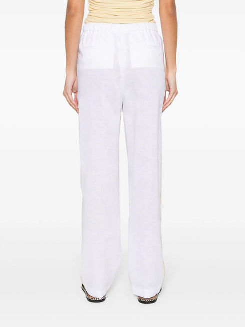 pantalones cónicos de chambray con ribete de tubo